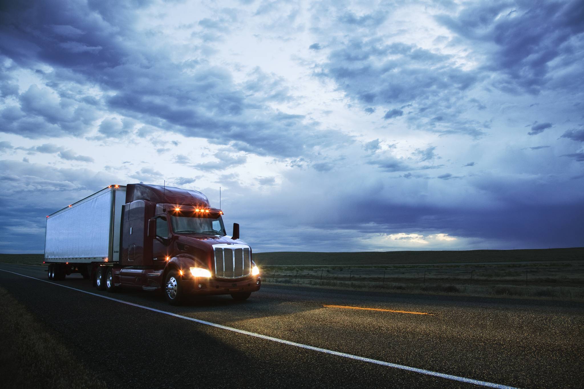 Top Gun Trucking & Rigging Class 8 truck on an Oregon highway